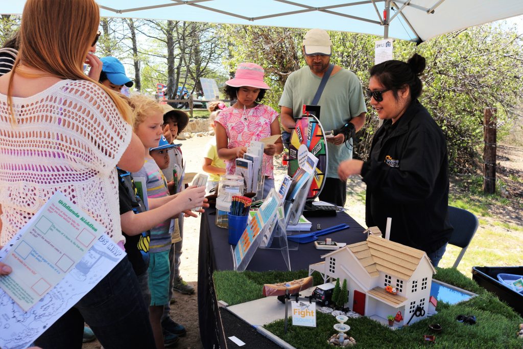 Health Education Specialist talking to the public about vector safety at the Arts and Nature Festival in Oak Glen.