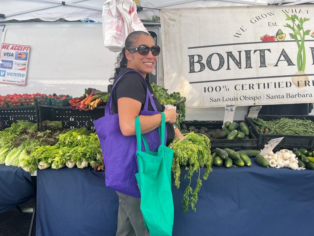 Health Education Assistant, Marilyn Alicea, at a farmers market.