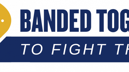 a yellow heart shaped as a folded bandage with a white county arrowhead at the center. the words, "Banded together" are next to it and blow is a blue ribbon that is coming off of the side of the heart. Inside of the ribbon are the words, "To fight the flu".