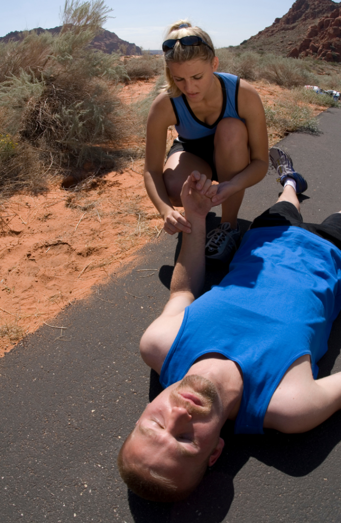 A man faints after having heat stroke while running during midday when the sun is most hot.